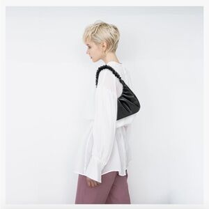 Like new, black shoulder handbag by Petite Simone